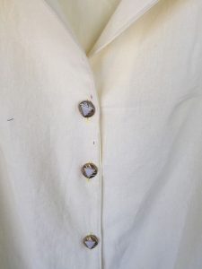 Lutterloh yellow linen blouse button close up